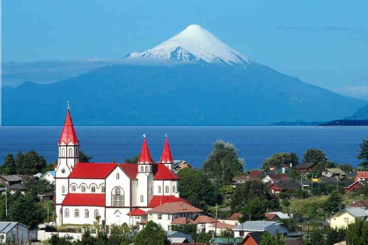 View of Puerto Varas, Los Lagos Region, with Osorno Volcano and Llanquihue Lake in the background.